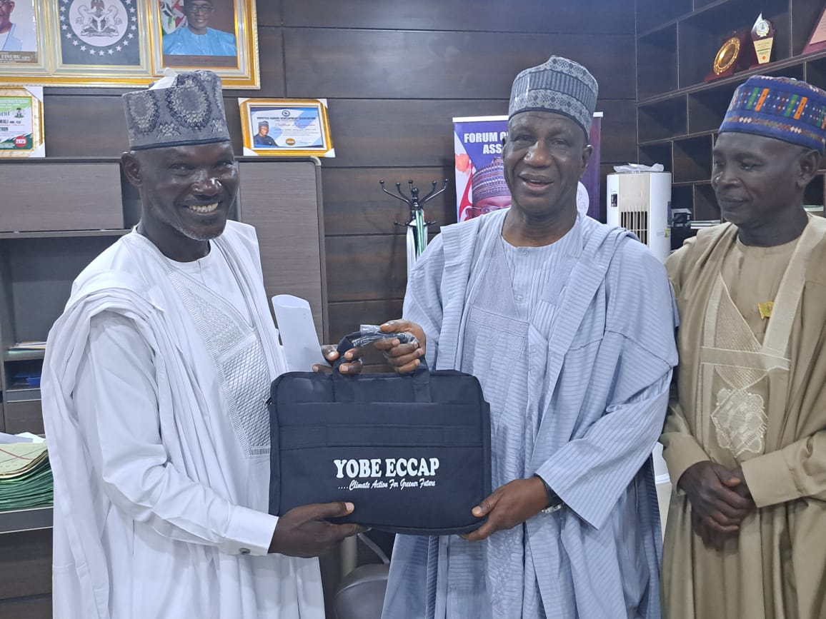 ECCAP Project Coordinator Adamu Ibrahim Nguru, the SSG Alhaji Baba Mallam Wali, and GM Yobe State Environmental and Sanitation Agency presenting ECCAP Advocacy and Sensitization Material to the Secretary of Yobe State
